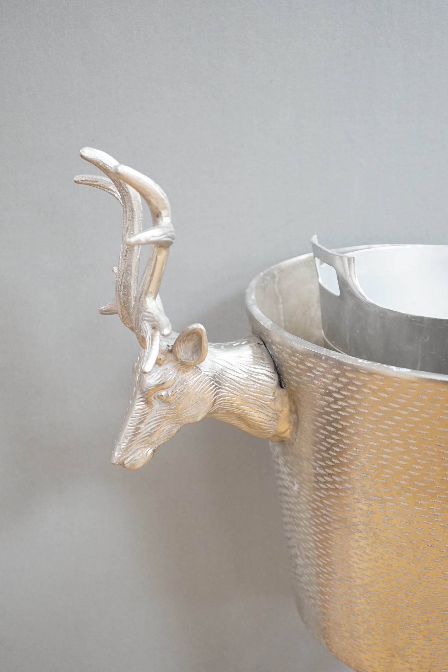 An aluminium stag handled floor standing wine / champagne cooler, another and three table top wine coolers, tallest 86cm high